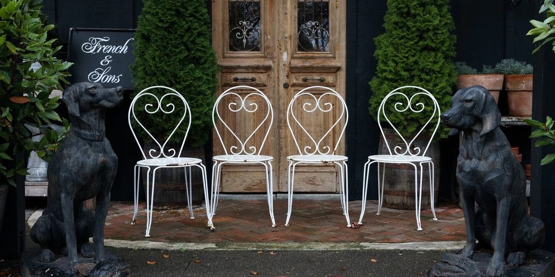 French & Sons store, a popular second-hand furniture store in Bulls, Auckland, with a vintage door and its famous bull sculptures on their front store