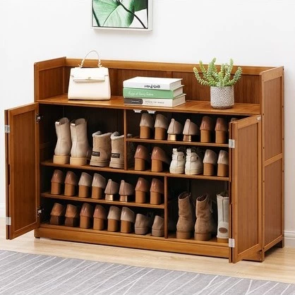 A bamboo shoe storage full of neatly lined up footwear