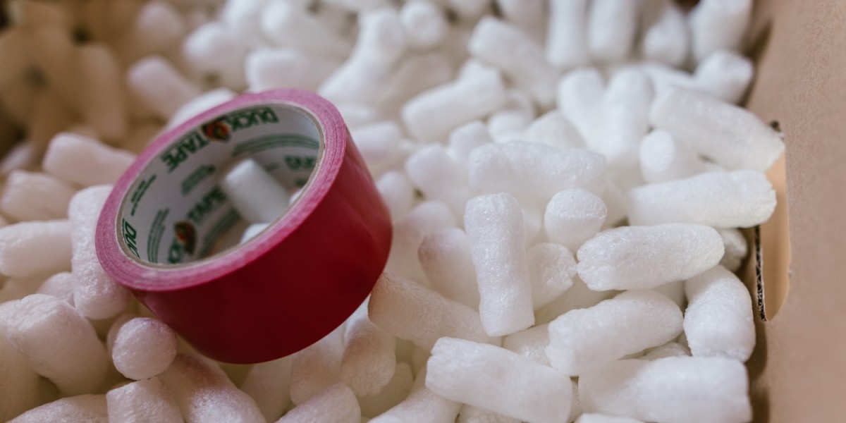 A box of packing peanuts and packing tape