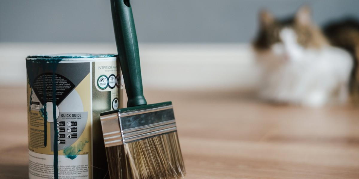 A can of paint and an unused paintbrush, a combination of tools to add a personal touch to your rental space without breaking the bank