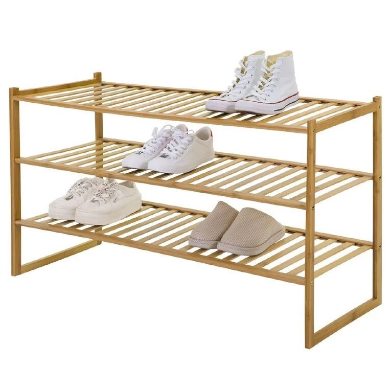 A couple of shoes placed on a shoe rack 