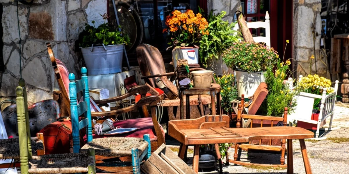 A pile of second-hand furniture is seen outside a house, with little polishing, these furniture will be ready to furnish a flat without having to spend a fortune
