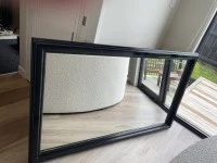 Large black framed mirror
