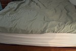 Queen bed, Dining table with chairs, Fridge, Sofa, Coffee table, Digit...