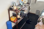 Queen bed, Bamboo shelves, Two low wooden shoe racks, Small desk, Sing...