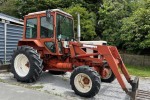 Farm tractor with front loader bucket