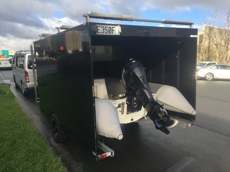 Inflatable boat Grand 5m in enclosed Trailer