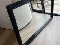 Large black framed mirror