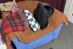 A qeen sized bed, A sofa for two, A desk, A chair, A small dining desk...