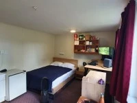 Queen bed with mattress, Dresser, Desk, 30 clothes coats, jackets, pan...