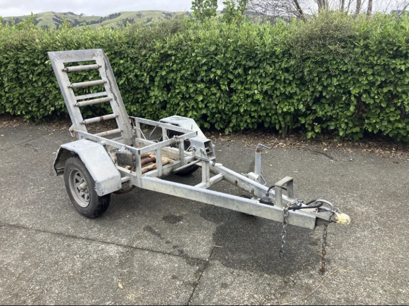 Small trailer with a plate compactor