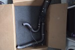 Harley exhaust in box about 110cm long by 73cm high by 20cm wide