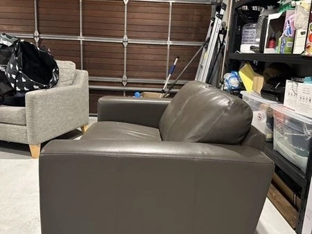 Dark Grey Leather 2 Seated Counch Well Protected