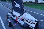 Small boat Foiling Dingy Waszp on Road Trailer