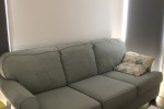 3 seats sofa, one seat sofa, a small dining table and four chairs that...