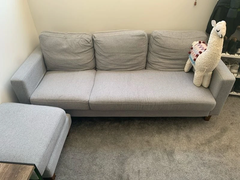 Grey couch with ottoman