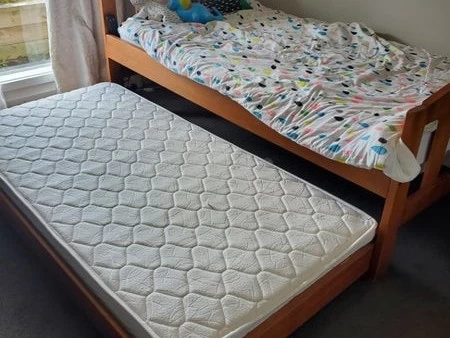 Wooden single bed with trundle and 2 mattresses