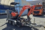 Digger on a tandem trailer