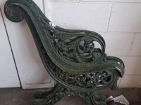 Two cast iron park bench ends