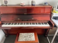 Brunswick upright piano and stool