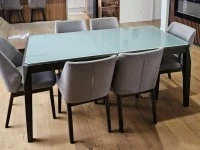 Dinning table with glass top and 6 chairs.