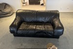 Two double leather sofas and a 120 cm round table