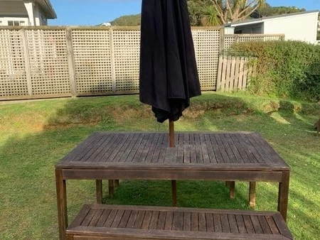 Outdoor table, bench seats & umbrella