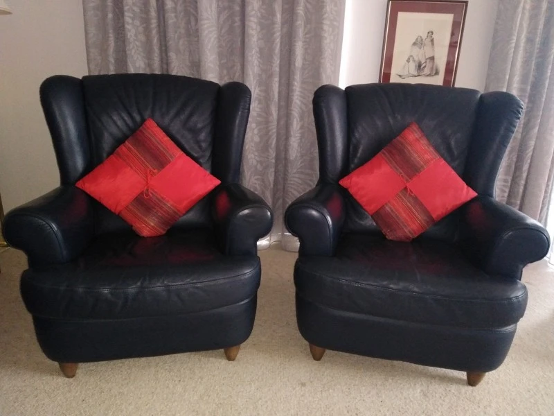 Two wing back arm chairs