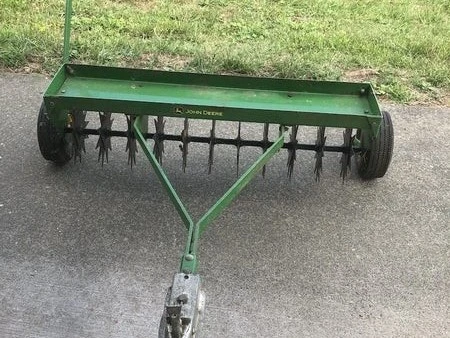 Tow behind lawn aerator