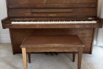 Small console upright piano