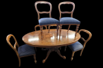 Round Dining table plus six chairs,, 3 piece cane couch 2 chairs and 2...