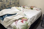 A qeen sized bed, A sofa for two, A desk, A chair, A small dining desk...