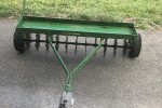 Tow behind lawn aerator