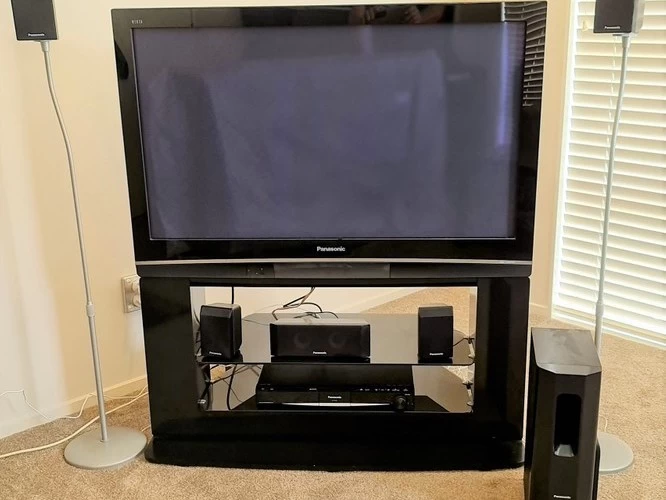 Panasonic 42" flat screen tv with home theatre and cabinet