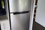 Lounge Chair + Poof, Single door fridge, Boxes of tools, Washer, Dryer