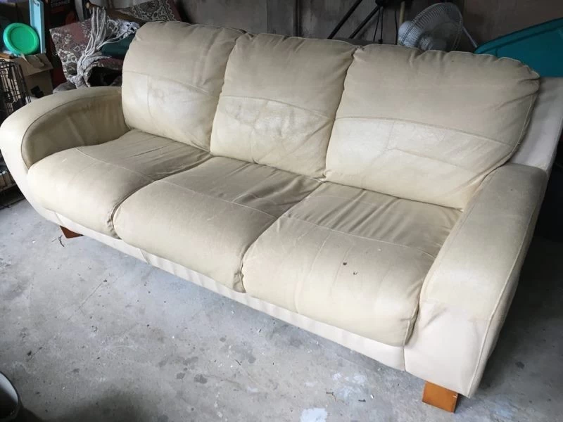 Comfy leather couch with stretch cover