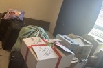 Glass desk, chair medium size, 7x boxes of packed clothes, 3x laundry ...