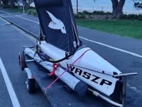 Small boat Foiling Dingy Waszp on Road Trailer