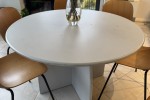 Two double leather sofas and a 120 cm round table