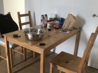 3 seats sofa, one seat sofa, a small dining table and four chairs that...