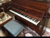 Old wooden vertical piano