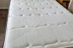 King single adjustable bed with headboard.