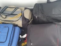 1 x oval table, 5 packed boxes, 5 packed suitcases