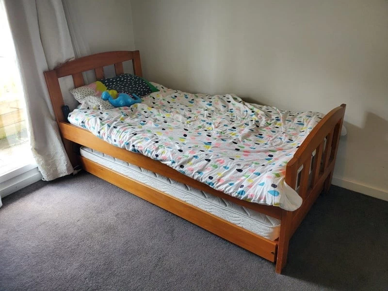 Wooden single bed with trundle and 2 mattresses