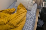Single king bed and some boxes