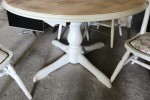 Solid timber round extendable table and four chairs