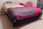 Queen size bed mattress and base, Fridge standing on top of a drawer, ...