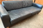 Black leather couch- 2.14m long, 0.9m deep, 0.7m high.