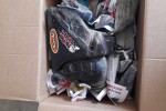 Box of motorbike plastics and one rear suspension