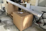 Two chairs in a box and one rug